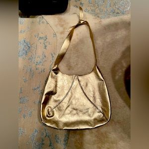 Designer gold voltaatelier bag. Made in Brazil.